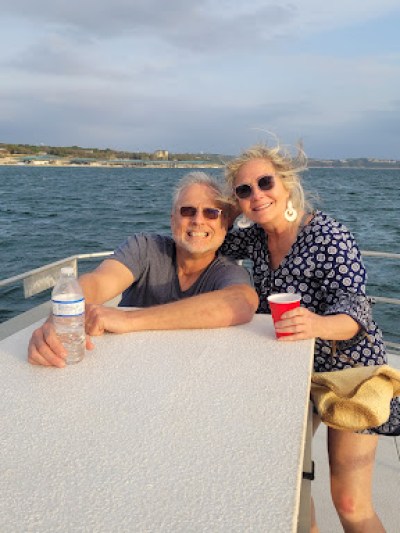 a couple riding one of the party barge of Centex Boat Rentals