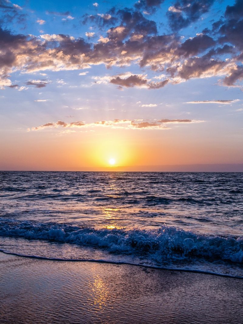 a sunset over a beach