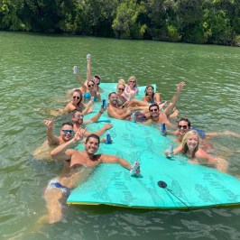 a group of people swimming in a body of water